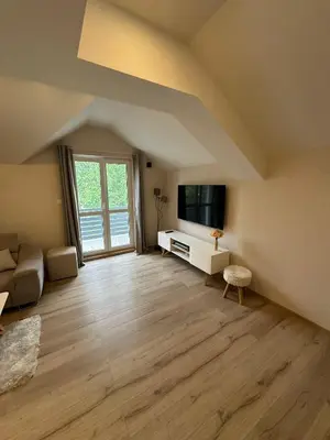 a living room with a couch and a tv at Apartments LaVu in Belgrade