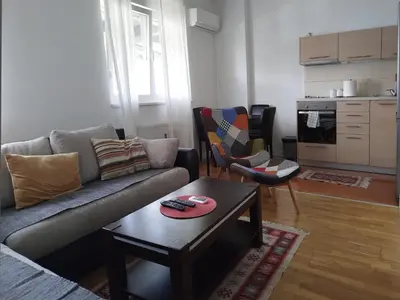 a living room with a couch and a coffee table at Apartman Natasa in Karaburma
