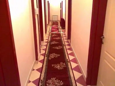 a hallway with a long line ofriminationacersacersacersngthngthngth at Hostel M in Belgrade