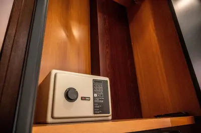 a microwave sitting on top of a wooden shelf at NATALI Luxury suites PARKING in Belgrade