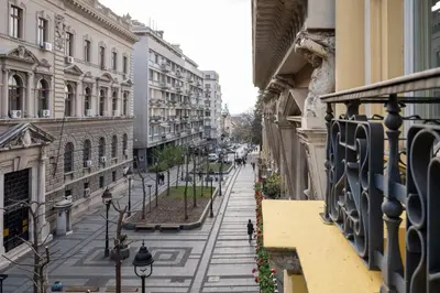 an empty city street with buildings and street lights at NATALI Luxury suites PARKING in Belgrade