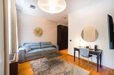 a living room with a couch and a table at NATALI Luxury suites PARKING in Belgrade