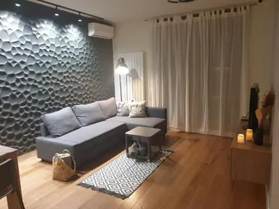 a living room with a couch and a table at Apartment Mona in Belgrade