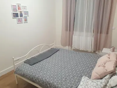 a bedroom with a bed in a room at Apartment Mona in Belgrade