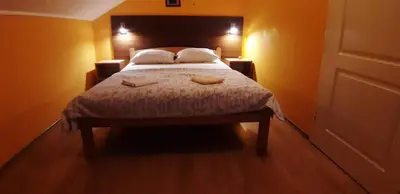 a bedroom with a bed with two towels on it at Rosso Apartments 2 in Belgrade