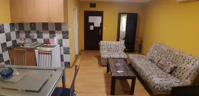 a living room with a couch and a table at Rosso Apartments 2 in Belgrade