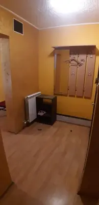 an empty room with yellow walls and mirrors at Rosso Apartments 2 in Belgrade