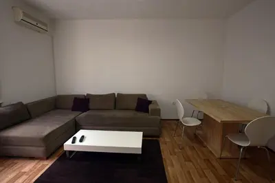 a living room with a couch and a table at Royal MegaKing apartment in Belgrade