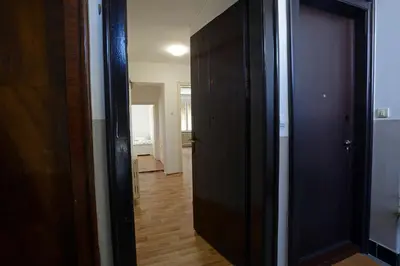 an open door to a room with a hallway at Royal MegaKing apartment in Belgrade