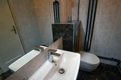 a bathroom with a sink and a toilet at Royal MegaKing apartment in Belgrade