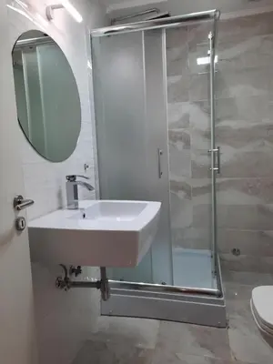 a bathroom with a sink and a shower at Apartman 57 in Vračar (historical)