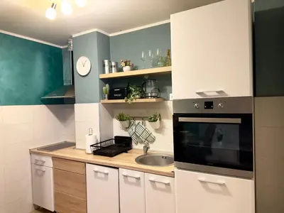a small kitchen with a sink and a microwave at Belgrade Apartment 1 in Zvezdara