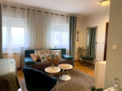 a living room with a couch and a table at Belgrade Apartment 1 in Zvezdara