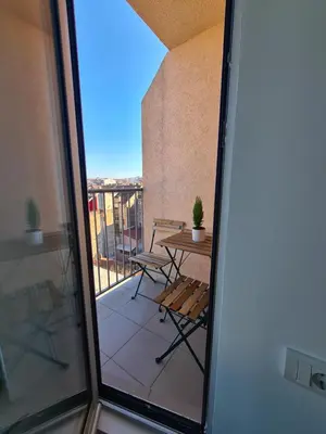 a view of a balcony with a table and chair at Jordan Apartment - City Center in Belgrade