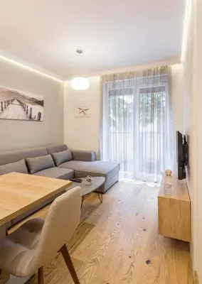 a living room with a couch and a table at Belly in Vračar (historical)
