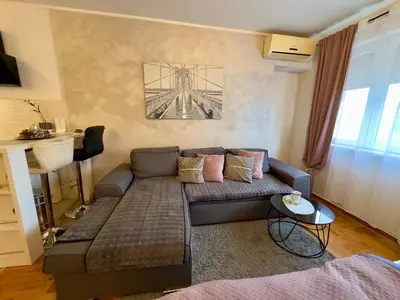 a living room with a couch and a table at Belgrade Apartment 2 in Zvezdara