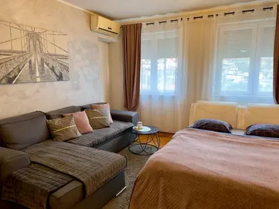 a living room with two beds and a couch at Belgrade Apartment 2 in Zvezdara