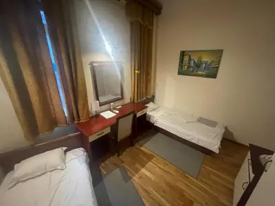 a small room with a sink and a mirror at Traveling Actor Skadarlija in Belgrade