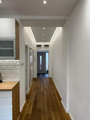 a hallway of a home with white walls and wood floors at Apartment, Stari Grad, Belgrade in Belgrade