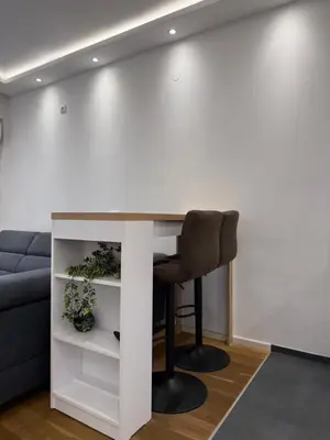 a white desk with a chair in a living room at Apartment, Stari Grad, Belgrade in Belgrade