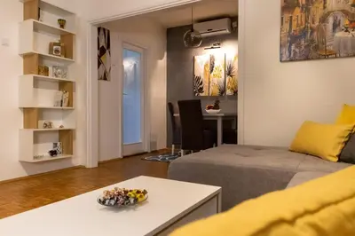 a living room with a couch and a table at Apartman 22 in Belgrade
