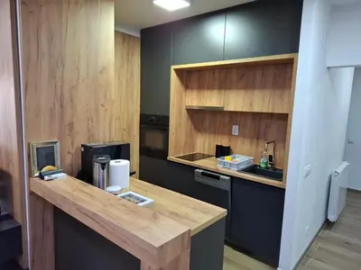 a kitchen with a wooden counter and a sink at Serbian home - 44, Gandijeva 184, free parking in Bežanija