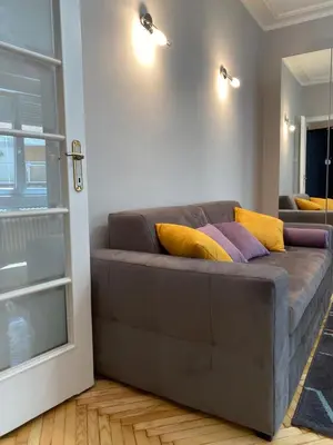 a couch with pillows on it in a living room at Dragon in Belgrade