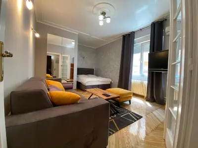 a living room with a couch and a bed at Dragon in Belgrade