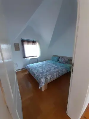 a bedroom with a bed in a room with a window at Apartment Ken in Surčin