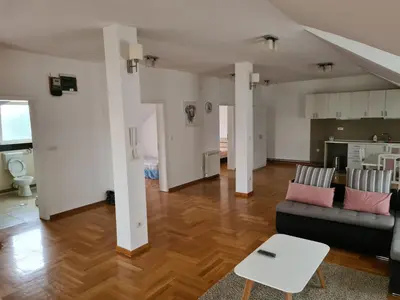 a living room with a couch and a table at Apartment Ken in Surčin