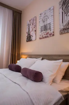 a bedroom with two beds with pillows on them at Galaxy Apartments in Belgrade