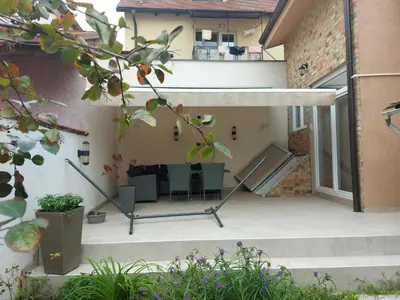 an external view of a house with a patio at Damun in Belgrade