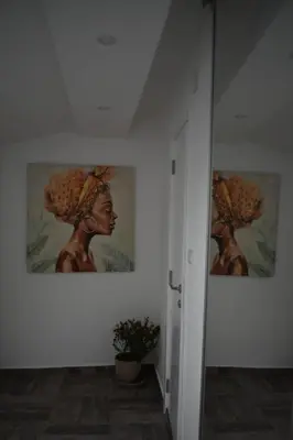 a hallway with two paintings on the walls of a room at Damun in Belgrade