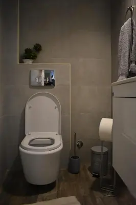 a bathroom with a white toilet in a room at Damun in Belgrade