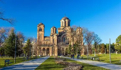 a large stone building with a clock tower at Apartment Major in Belgrade