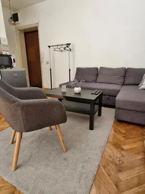 a living room with a couch and a coffee table at Apartment Major in Belgrade