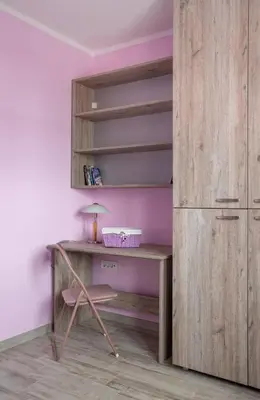 a desk with a chair next to a closet at Mici Luxury Apartments in Ledine