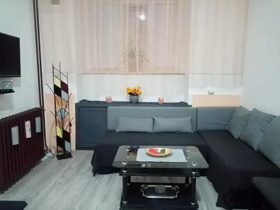 a living room with a couch and a table at Apartment Anna in Belgrade