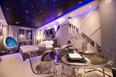 a bedroom with a starry ceiling and a glass table at Aurora Lux Spa Smart apartments in Belgrade
