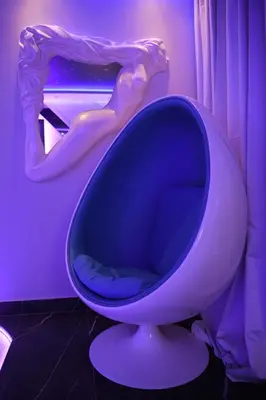 a blue toilet in a room with a mirror at Aurora Lux Spa Smart apartments in Belgrade
