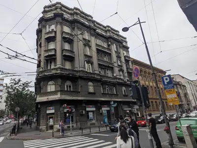 an old building on the corner of a city street at Danka in Belgrade