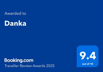 a blue square with the words awarded to danka traveler review awards at Danka in Belgrade