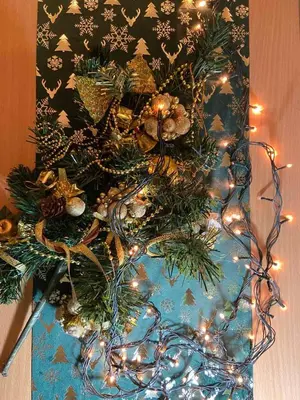 a christmas tree with lights on a table at Bella apartment in Belgrade