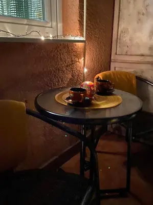 a table with a plate of food on it at Bella apartment in Belgrade