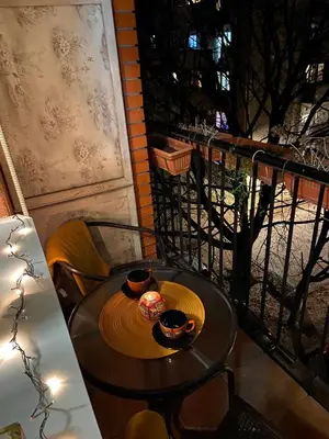 a table with two bowls of food on a balcony at Bella apartment in Belgrade