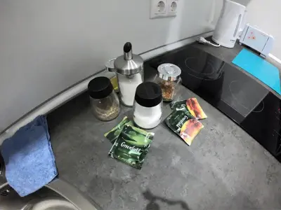 a counter top with food and coffee on it at Sofia Apartment in Surčin