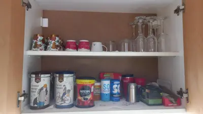 a cabinet filled with lots of cans and bottles at Sofia Apartment 2 in Surčin