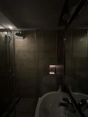 a bathroom with a glass shower and a sink at Belgrade Pearl with free parking in Belgrade
