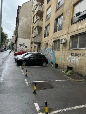 a parking lot with a car parked next to a building at Belgrade Pearl with free parking in Belgrade