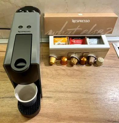 a coffee robot next to a box of food at Apartment SUN CITY 2 in Belgrade